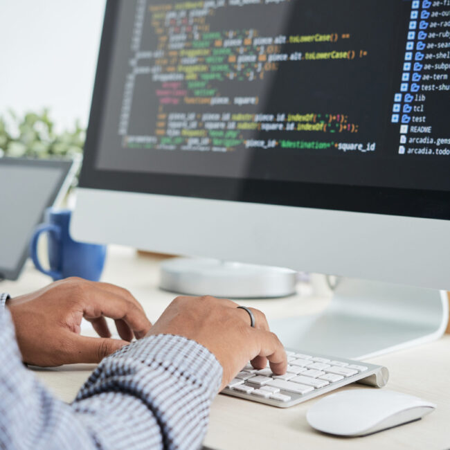 Coding man Cropped image of It specialist working on code